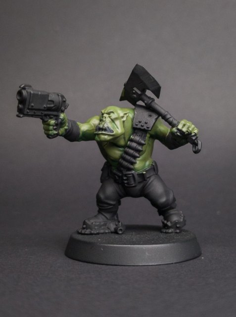 How I paint an Ork, Skin, step 3: The blend: a 50/50 mix of Dark and Cayman greens, thinned to a glaze, worked over each join until the layers run into…